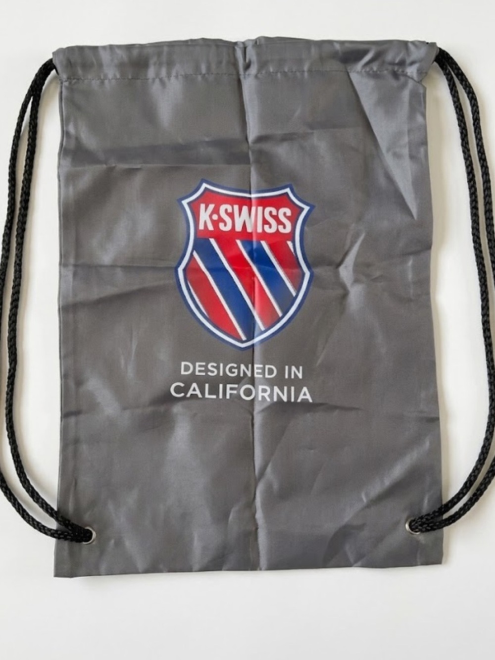 NWOT K-Swiss Gray Drawstring Backpack with Red & Blue Crest
